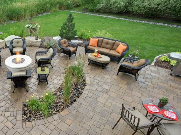 Paver patio with wicker furniture and fire table