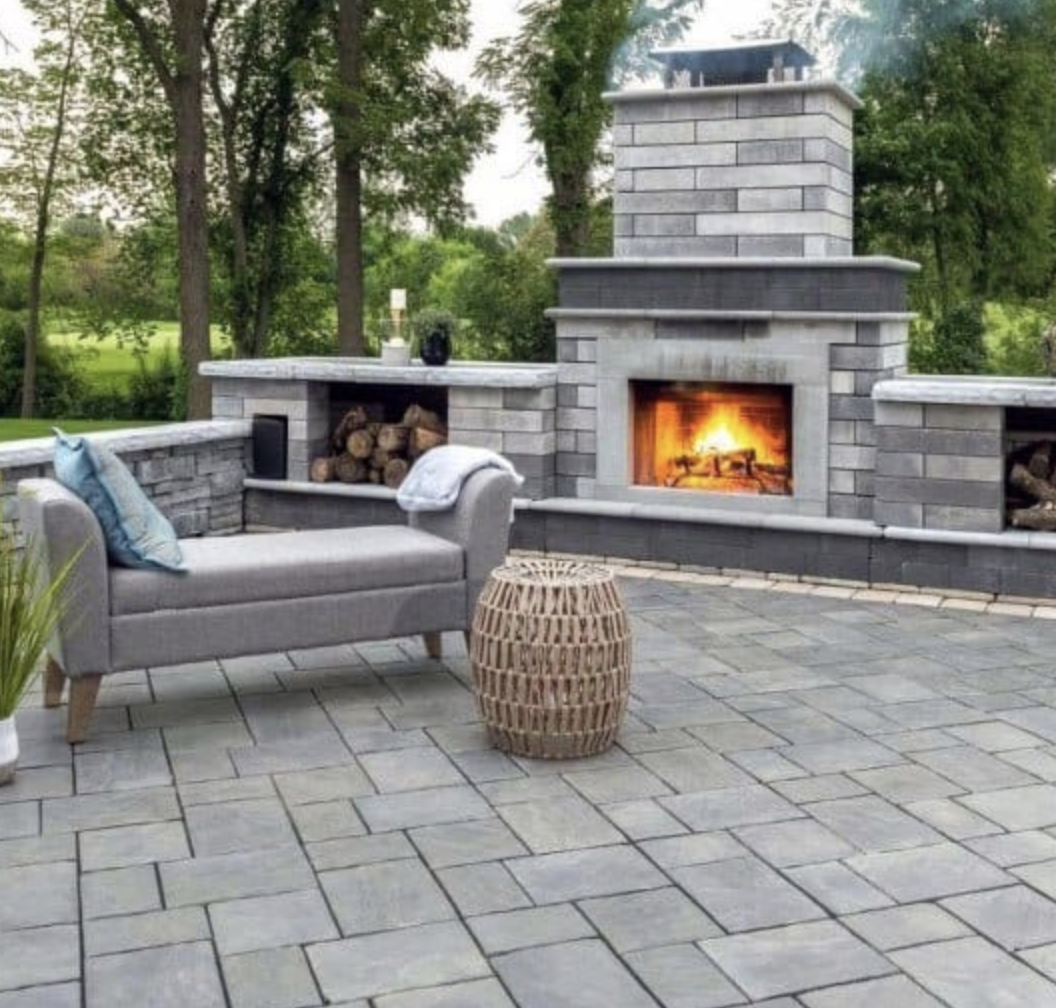 Stone patio with outdoor fireplace