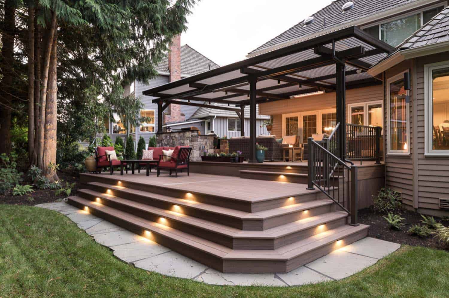 Deck with built-in LED step and riser lighting at dusk