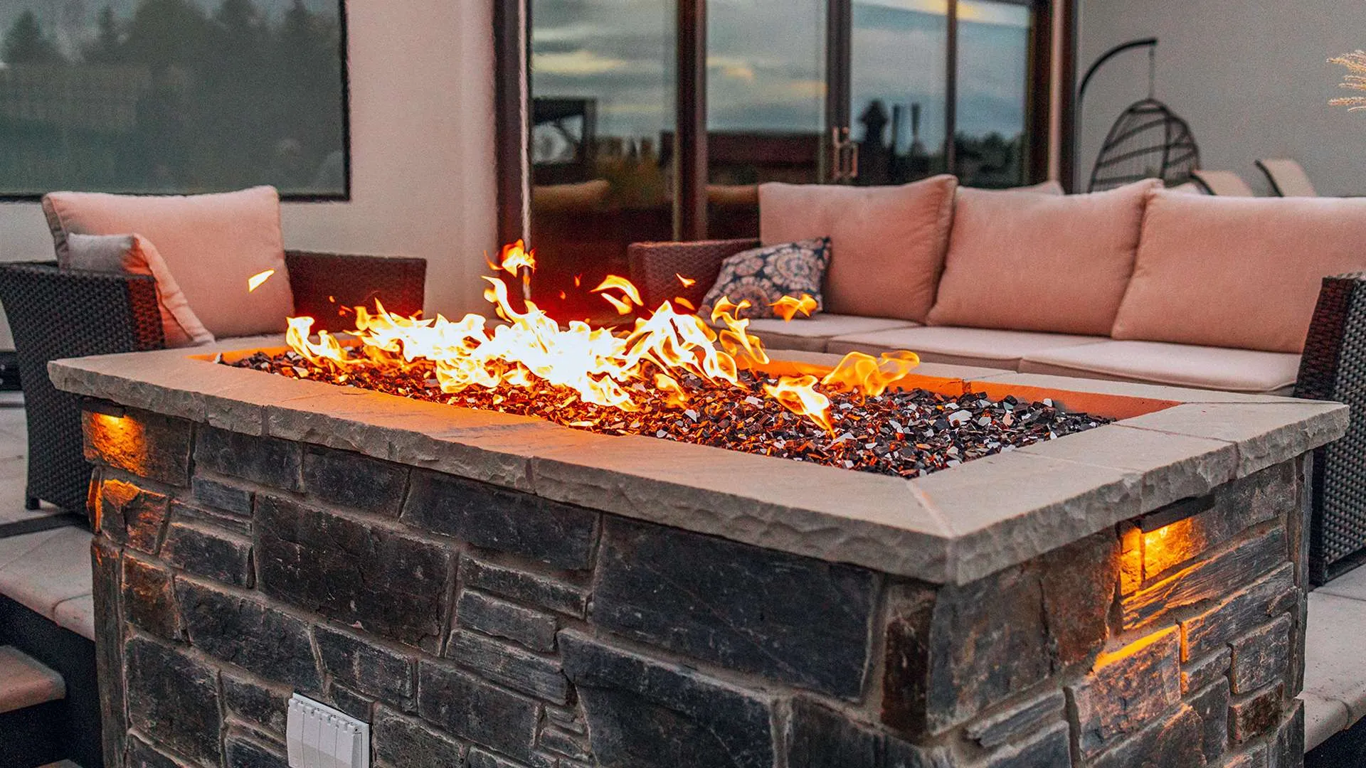 Custom built-in fire pit with stone surround
